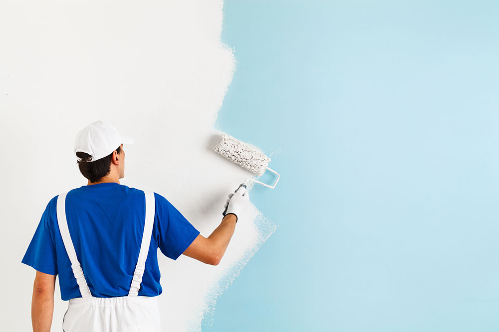 Colorado Spring Painter Painting a Wall with Paint Roller